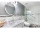 Bathroom features a single vanity with marble countertops and updated shower at 3351 Lintower Dr, Land O Lakes, FL 34638