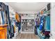Walk-in closet with custom shelving and ample storage space for clothes and shoes at 3351 Lintower Dr, Land O Lakes, FL 34638
