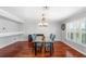 Dining room featuring a glass table set with hardwood floors and bright natural light at 3351 Lintower Dr, Land O Lakes, FL 34638
