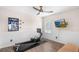 This bright exercise room features a rowing machine and a wall-mounted TV for an enjoyable workout at 3351 Lintower Dr, Land O Lakes, FL 34638