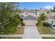 Charming two-story home with a well-manicured lawn and a two car garage, and mature trees at 3351 Lintower Dr, Land O Lakes, FL 34638