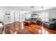 Bright living room featuring hardwood floors, neutral wall colors, a large sofa, and comfortable seating at 3351 Lintower Dr, Land O Lakes, FL 34638