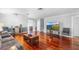 Bright living room featuring hardwood floors, modern furniture, and neutral wall colors at 3351 Lintower Dr, Land O Lakes, FL 34638