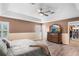 Bright bedroom with ensuite closet and wood-look floors and shutters at 3351 Lintower Dr, Land O Lakes, FL 34638