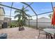 Spacious screened-in patio with brick flooring, outdoor seating, and views of the backyard at 3351 Lintower Dr, Land O Lakes, FL 34638