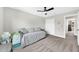 This bedroom features neutral walls, carpeted floors, a ceiling fan, and a closet at 3602 W Iowa Ave, Tampa, FL 33611