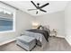 Bedroom features neutral walls, carpeted floors, a ceiling fan, and a window at 3602 W Iowa Ave, Tampa, FL 33611