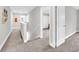 Upstairs hallway with carpet flooring and view of entry to another room at 3602 W Iowa Ave, Tampa, FL 33611