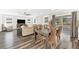 Open floor plan featuring the living room, dining area and kitchen. The room features hardwood floors at 3602 W Iowa Ave, Tampa, FL 33611