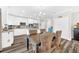 Bright kitchen featuring stainless appliances, lots of cabinet space, hardwood floors and a dining area at 3602 W Iowa Ave, Tampa, FL 33611
