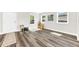 Inviting living room with beautiful wood floors, lots of natural light and a back door at 3602 W Iowa Ave, Tampa, FL 33611