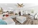 Open concept living area features hardwood floors and a flowing layout into the kitchen and dining area at 3602 W Iowa Ave, Tampa, FL 33611