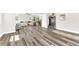 Spacious living room featuring hardwood floors and an open layout, perfect for entertaining and relaxing at 3602 W Iowa Ave, Tampa, FL 33611
