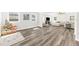 Bright and airy living room with wood floors and ample natural light from the many windows at 3602 W Iowa Ave, Tampa, FL 33611