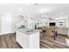 Bright open-concept home featuring an island with sink, dining area, and a spacious living room at 3602 W Iowa Ave, Tampa, FL 33611
