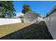 Side view of backyard with white fence at 3615 W Cherry St, Tampa, FL 33607