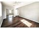Bright bedroom with hardwood floors, neutral paint, and sliding door closet at 3615 W Cherry St, Tampa, FL 33607