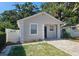 Charming home featuring a well-maintained front yard and paver driveway at 3615 W Cherry St, Tampa, FL 33607