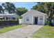 Inviting single-story home with a paved driveway and a manicured green lawn at 3615 W Cherry St, Tampa, FL 33607