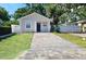 Charming single-story home with a neatly paved driveway and well-maintained lawn at 3615 W Cherry St, Tampa, FL 33607