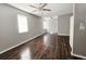 Inviting living room featuring sleek hardwood floors and ample natural light from large windows at 3615 W Cherry St, Tampa, FL 33607