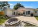 The backyard patio area features a fire pit and seating area at 4208 W Bay Vista Ave, Tampa, FL 33611