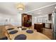 Bright, spacious dining area open to the kitchen, featuring a large table and stainless steel appliances at 4208 W Bay Vista Ave, Tampa, FL 33611