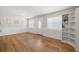 Bright living area with hardwood floors and a large window at 4208 W Bay Vista Ave, Tampa, FL 33611