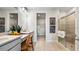 Modern bathroom featuring dual sinks, a walk-in shower, and stylish fixtures at 4286 Cairoli Ct, Wesley Chapel, FL 33543