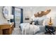 Serene bedroom featuring a comfortable bed, stylish decor, and soft natural light from the window at 4286 Cairoli Ct, Wesley Chapel, FL 33543
