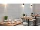 Cozy cafe setting with tables, chairs, and decorative lighting, perfect for casual dining and relaxation at 4286 Cairoli Ct, Wesley Chapel, FL 33543