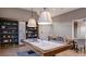 A game room featuring a pool table, custom shelving, pendant lights, and seating for a cozy gathering at 4286 Cairoli Ct, Wesley Chapel, FL 33543