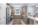 Well-lit kitchen featuring stainless steel appliances and stylish cabinetry at 4286 Cairoli Ct, Wesley Chapel, FL 33543