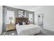 Inviting bedroom with plush bedding, decorative pillows, bedside tables, lamps, and complementing curtains at 4381 Sand Dollar Way, Zephyrhills, FL 33541