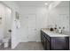 Bright bathroom featuring double vanity with modern fixtures and granite countertop at 4401 Sand Dollar Way, Zephyrhills, FL 33541
