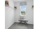 Walk-in closet with adjustable shelving, seating, and natural light at 4401 Sand Dollar Way, Zephyrhills, FL 33541