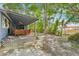 Lush backyard featuring a covered patio, mature trees, and a relaxing outdoor space at 4801 71St N St, St Petersburg, FL 33709