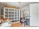 Bedroom with white door, wall storage, laminate floors, ceiling fan, and vanity table at 4801 71St N St, St Petersburg, FL 33709