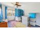 Bedroom featuring a ceiling fan, bright window, and storage bins at 4801 71St N St, St Petersburg, FL 33709