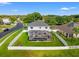 The areal view shows the property's fenced yard, screened-in pool, and proximity to neighborhood streets at 4805 Holdsworth Dr, Land O Lakes, FL 34639