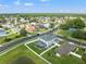 An areal view showcases the property's lush landscaping, screened-in pool, and neighborhood amenities at 4805 Holdsworth Dr, Land O Lakes, FL 34639