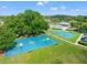 Aerial view of two community basketball courts surrounded by lush greenery and trees at 4805 Holdsworth Dr, Land O Lakes, FL 34639