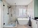 Serene bathroom showcases a modern soaking tub, walk-in shower, and stylish fixtures at 4805 Holdsworth Dr, Land O Lakes, FL 34639