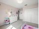 Cozy bedroom with soft carpet, large closet, and pastel decor at 4805 Holdsworth Dr, Land O Lakes, FL 34639