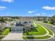 Two-story home showcasing a well-manicured lawn and a three car garage at 4805 Holdsworth Dr, Land O Lakes, FL 34639