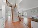 Inviting foyer with staircase, opens to dining room area with hardwood floors at 4805 Holdsworth Dr, Land O Lakes, FL 34639