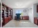 Functional home office with built-in bookshelves, desk space, and natural light from the window at 4805 Holdsworth Dr, Land O Lakes, FL 34639