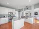 Bright kitchen with a center island, stainless steel appliances, and ample cabinet space at 4805 Holdsworth Dr, Land O Lakes, FL 34639