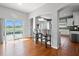 Modern kitchen featuring a breakfast bar, stainless appliances, and a view of the pool at 4805 Holdsworth Dr, Land O Lakes, FL 34639