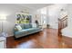 Cozy living room features hardwood floors and a view of the front yard at 4805 Holdsworth Dr, Land O Lakes, FL 34639